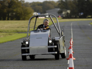 Lord Drayson, in an electric car