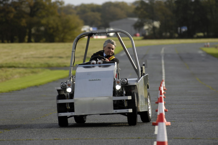 Lord Drayson, in an electric car