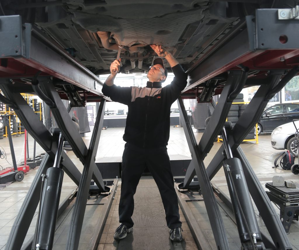 Man inspecting vehicle